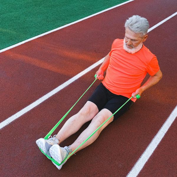 Calendar and sports equipment symbolizing integration of exercise into a daily routine.